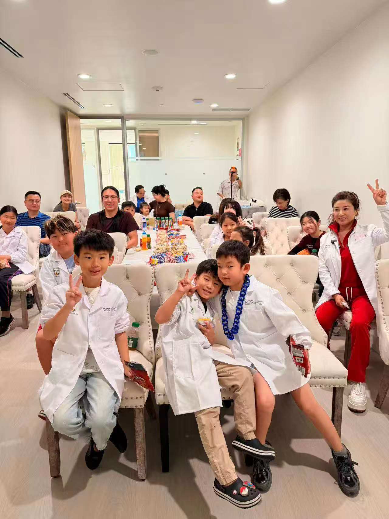 RES Dental community event with kids wearing white coats